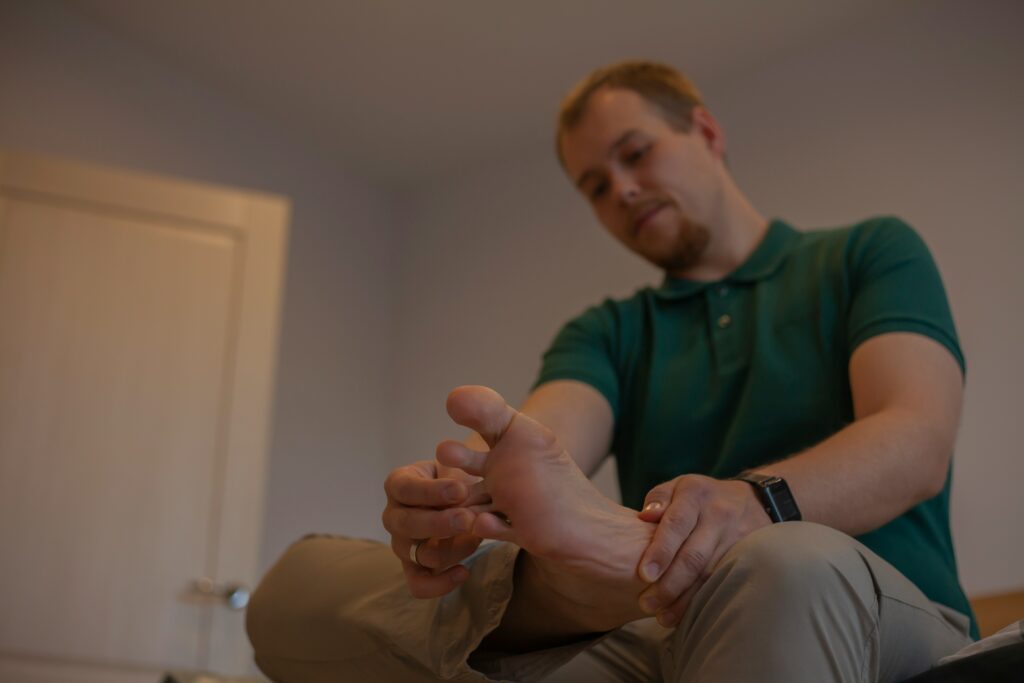 Why Are My Feet Cramping? covering muscle strain, dehydration, electrolyte changes, stretching, massage, supportive footwear, and warning signs.
