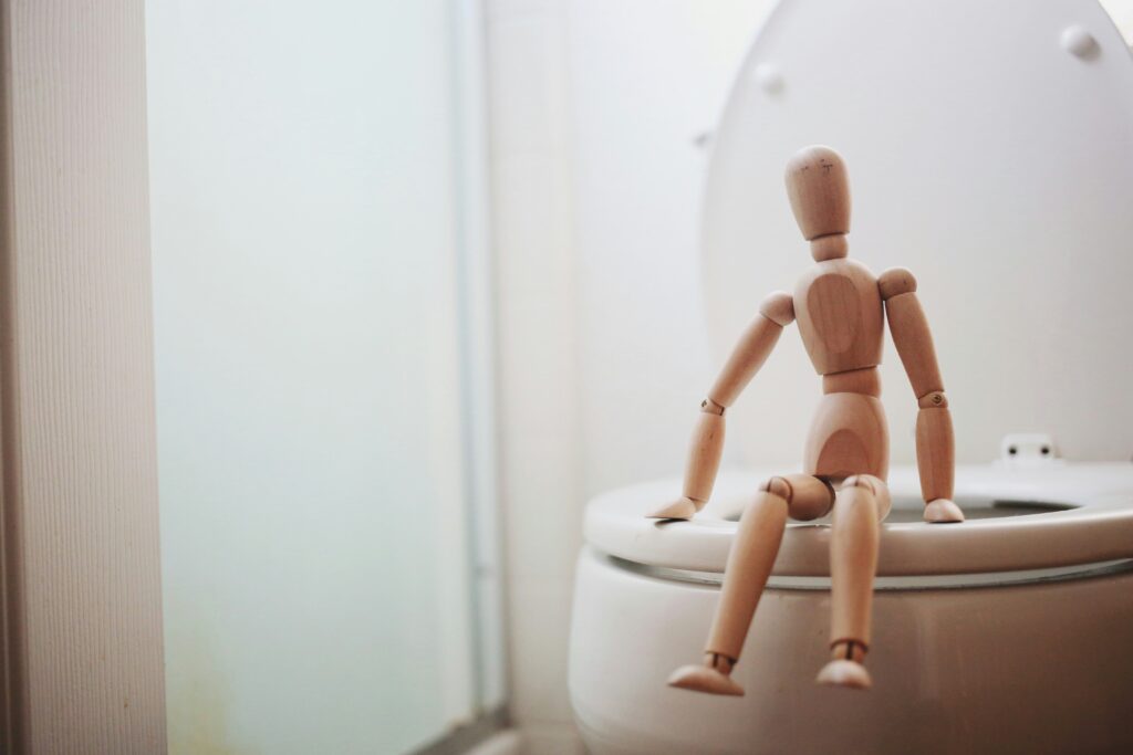 How to Unclog Toilet Without Plunger: Educational illustration demonstrating effective toilet unclogging techniques using hot water, dish soap, and other safe methods.